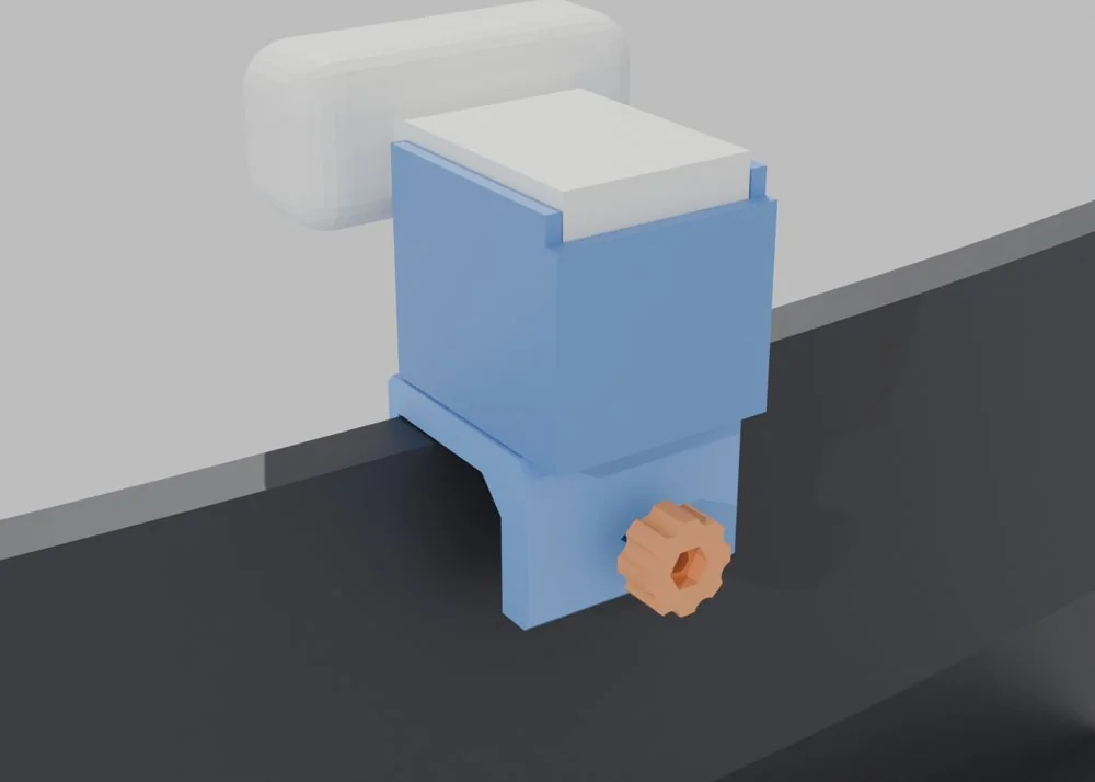Render of a blue printed C-shaped clamp on the top edge of a curved dark monitor with a dock block and webcam above it and an orange knob on the rear jaw